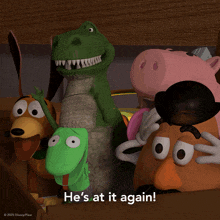 a group of toy story characters with the words he 's at it again at the bottom