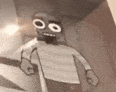 a black and white drawing of a cartoon character holding a knife in a room .
