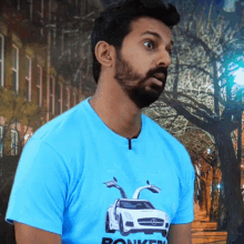 a man wearing a blue shirt that says bonkers