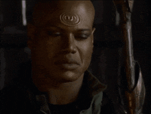 a bald man with the word indeed written on his face