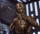 a close up of a robot with a green light