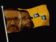 a flag with two men on it and the letters br and s on it