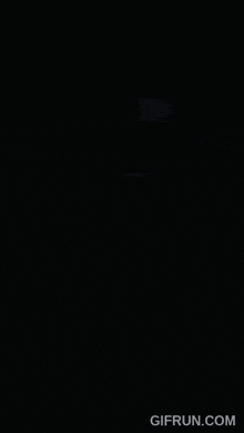 a picture of a skeleton with blue eyes and the website gifrun.com underneath it