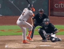 a baseball player named bailey is swinging his bat