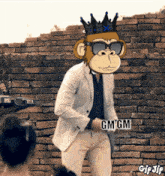 a monkey wearing sunglasses and a crown holds a gm gm sticker in front of a brick wall