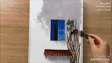 a person is painting a picture with sap green and phthalo blue paint