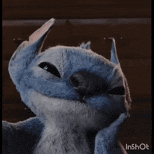 a close up of a stuffed animal with the word inshot on the bottom right