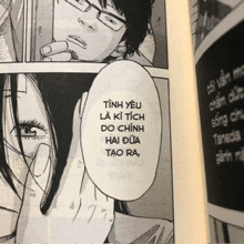 a book is open to a page that says tinh yeu la ki tch do chinh hai dua tao ra