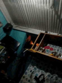 a blurred image of a room with a couch and a shelf