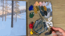a painting of a snowy forest is being painted on a canvas by a person