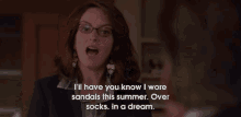 a woman wearing glasses says " i 'll have you know i wore sandals this summer over socks "