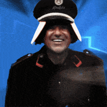 a man wearing a hat that says arabiis on it