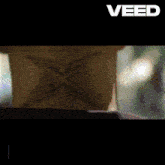 a close up of a man 's face with the word veed on the top
