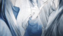 a blurry picture of a person in a blue shirt and tie