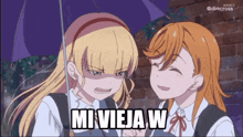 two anime girls are standing under an umbrella with the words mi vieja w on the bottom