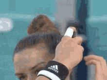 Maria Sakkari Hair Spray GIF