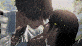 a man and a woman are kissing with petals on their hair