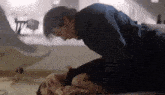 a man and a woman are laying on the floor .