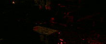a person is laying in a coffin with red lights behind them
