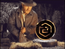 a man in a cowboy hat looks at a coin with a snake on it