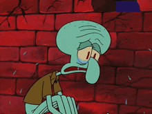 squidward from spongebob is crying in front of a brick wall