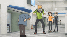 a group of people are standing in a hallway and one of them is wearing a green jacket with a skull on it