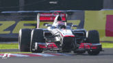 a race car that has the word replay on the side