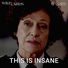 a woman with a serious look on her face and the words this is insane