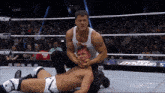 two men in a wrestling ring with aew on the bottom right