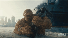 a poster for the movie fantastic four shows the thing holding a chain