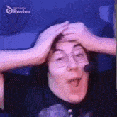 a person is making a funny face with their hands on their head and the words made with revive on the bottom