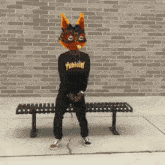 a person wearing a thrasher shirt and a mask