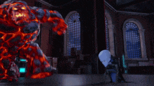 a person is standing in front of a large sculpture that looks like lava