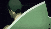 a man is taking a bath in a bathtub with a green blanket