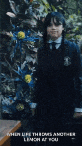 a girl in a school uniform with the words when life throws another lemon at you at the bottom