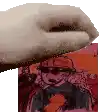 a close up of a person 's hand holding a picture of a man in a hard hat .