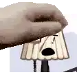 a close up of a person holding a cartoon character .