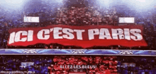 a soccer stadium with a banner that says ici c'est paris