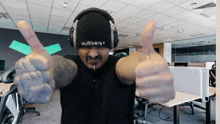 a man wearing headphones and a hat that says multiverse