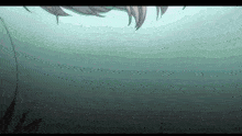 a person is swimming in the water and looking up at the sky