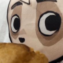 a close up of a cartoon face with a big c on it