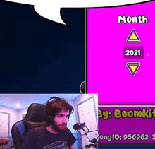 a man wearing headphones is sitting in front of a microphone in a room .