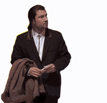 a man in a suit and tie is holding a brown jacket over his shoulder