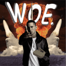 a man stands in front of a rocket with the word woe on it