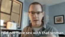 a blurry picture of a man with the words " i did not have sex with that woman " below him
