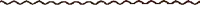 a row of brown sticks on a white background