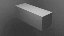 a white cube is sitting on a gray background