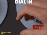 a person is pressing a button that says dial in over