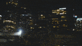 a pixelated image of a person holding a blue light