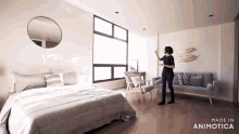 a woman is standing in a bedroom with the words made in animatica on the bottom